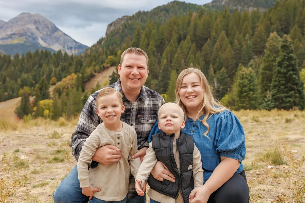 Zac Lovell, owner of TOR Turf, with his wife and two sons in the Utah mountains